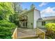 Expansive backyard with wooden deck and balcony, perfect for outdoor entertaining and relaxation at 3 Fairway Nw Dr, Kennesaw, GA 30144