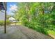 Backyard deck with lush greenery and mature trees, offering a private and tranquil setting at 3 Fairway Nw Dr, Kennesaw, GA 30144