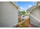 Balcony view showcasing exterior architecture and the parking lot with greenery in the background at 3 Fairway Nw Dr, Kennesaw, GA 30144