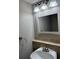 Bright bathroom featuring a clean white sink and decorative lighting fixtures, offering a refreshing space at 3 Fairway Nw Dr, Kennesaw, GA 30144