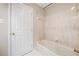 Bathroom with a white door, marbled shower surround, and white hexagon tile flooring at 3 Fairway Nw Dr, Kennesaw, GA 30144