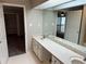 Bright bathroom with double sinks and vanity with a large mirror at 3 Fairway Nw Dr, Kennesaw, GA 30144