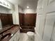 Bathroom with vanity, toilet, and shower/tub combination at 3 Fairway Nw Dr, Kennesaw, GA 30144