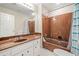 Full bathroom with a unique counter design and shower with bathtub combination at 3 Fairway Nw Dr, Kennesaw, GA 30144