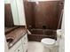 Bathroom features a marble sink countertop, bathtub, and a toilet at 3 Fairway Nw Dr, Kennesaw, GA 30144