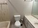 Bathroom with a toilet, sink with vanity, a mirror, and a bathtub at 3 Fairway Nw Dr, Kennesaw, GA 30144