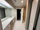 Bathroom with double vanity, open doorway to the tub and toilet at 3 Fairway Nw Dr, Kennesaw, GA 30144