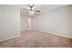 Neutral bedroom with a ceiling fan and carpet flooring, offering a blank canvas for personalization at 3 Fairway Nw Dr, Kennesaw, GA 30144