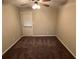 Bedroom featuring carpet, neutral walls, a ceiling fan and a windowed door with blinds at 3 Fairway Nw Dr, Kennesaw, GA 30144