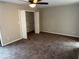 Spacious bedroom featuring neutral walls, ceiling fan and closet for ample storage at 3 Fairway Nw Dr, Kennesaw, GA 30144