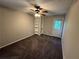 Bedroom with a ceiling fan and built in shelving, plus natural light at 3 Fairway Nw Dr, Kennesaw, GA 30144