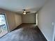 Bedroom with carpet, closet, and fan at 3 Fairway Nw Dr, Kennesaw, GA 30144
