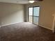 Bedroom with a sliding glass door to the exterior and neutral carpeting at 3 Fairway Nw Dr, Kennesaw, GA 30144