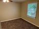 Bedroom with carpet, a window, neutral walls, and a ceiling fan at 3 Fairway Nw Dr, Kennesaw, GA 30144