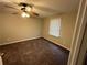 Bedroom features neutral paint, ceiling fan and plush carpet, providing a comfortable retreat at 3 Fairway Nw Dr, Kennesaw, GA 30144