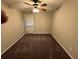 Bedroom with a ceiling fan, plush carpeting and natural light from a door at 3 Fairway Nw Dr, Kennesaw, GA 30144