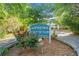 Pinetree Country Club Condominiums sign with flowers, showcasing the community's inviting entrance at 3 Fairway Nw Dr, Kennesaw, GA 30144