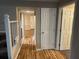 Hallway with hardwood floors and multiple doorways at 3 Fairway Nw Dr, Kennesaw, GA 30144
