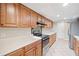 Updated kitchen with oak cabinets, modern appliances, and functional layout at 3 Fairway Nw Dr, Kennesaw, GA 30144