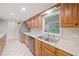 Traditional kitchen featuring stainless steel appliances, light countertops, and ample cabinet space at 3 Fairway Nw Dr, Kennesaw, GA 30144