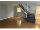 Living room with hardwood floors, staircase and natural light at 3 Fairway Nw Dr, Kennesaw, GA 30144