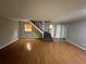 Living room featuring wood floors, stairs and neutral paint at 3 Fairway Nw Dr, Kennesaw, GA 30144