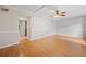 Spacious living room with hardwood floors and a classic ceiling fan at 3 Fairway Nw Dr, Kennesaw, GA 30144