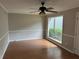 Spacious living room featuring wood floors, fresh paint and lots of natural light at 3 Fairway Nw Dr, Kennesaw, GA 30144
