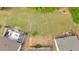 Drone view of homes showcasing spacious backyards with patios, offering outdoor living at 3321 Hampreston Nw Way, Kennesaw, GA 30144