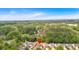 Aerial view showcases residential area surrounded by lush greenery and a vast tree canopy at 3321 Hampreston Nw Way, Kennesaw, GA 30144