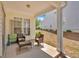 Cozy covered back porch with seating area and view of the backyard at 3321 Hampreston Nw Way, Kennesaw, GA 30144