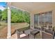 Inviting back porch with wicker furniture, perfect for outdoor relaxation at 3321 Hampreston Nw Way, Kennesaw, GA 30144