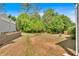 Large backyard with mature trees and partial fencing at 3321 Hampreston Nw Way, Kennesaw, GA 30144
