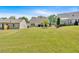 Expansive backyard with green lawn and a variety of trees at 3321 Hampreston Nw Way, Kennesaw, GA 30144