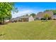 Well-kept backyard showcases a lush lawn and neighboring properties, perfect for recreation and relaxation at 3321 Hampreston Nw Way, Kennesaw, GA 30144