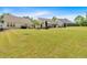 Expansive backyard featuring well-maintained lawn and neighboring homes, ideal for outdoor activities at 3321 Hampreston Nw Way, Kennesaw, GA 30144