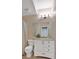 Well-lit bathroom showcasing a vanity with storage and classic fixtures at 3321 Hampreston Nw Way, Kennesaw, GA 30144