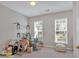 A bedroom with two windows and a white pouf needing tidying at 3321 Hampreston Nw Way, Kennesaw, GA 30144