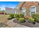 Close up of a charming home featuring stone accents and manicured landscaping at 3321 Hampreston Nw Way, Kennesaw, GA 30144