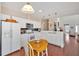 Bright kitchen boasts modern appliances, white cabinets, and a cozy breakfast nook at 3321 Hampreston Nw Way, Kennesaw, GA 30144