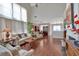 Expansive living room with soaring ceilings, large windows, and a cozy fireplace at 3321 Hampreston Nw Way, Kennesaw, GA 30144
