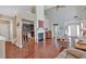 Open-concept living room with fireplace, built-ins, soaring ceilings, and hardwood floors at 3321 Hampreston Nw Way, Kennesaw, GA 30144
