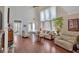 Spacious living room with soaring ceilings, large windows, and gleaming hardwood floors at 3321 Hampreston Nw Way, Kennesaw, GA 30144