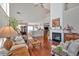 Bright and airy living room with hardwood floors, fireplace, and ample seating at 3321 Hampreston Nw Way, Kennesaw, GA 30144