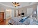 Comfortable main bedroom with tray ceiling, hardwood floors, and ensuite bathroom access at 3321 Hampreston Nw Way, Kennesaw, GA 30144