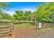 Serene park featuring lush greenery, walking trails, and a charming forest area for Gathering-friendly outdoor activities at 3321 Hampreston Nw Way, Kennesaw, GA 30144