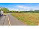 Expansive green space with walking path and a playground, perfect for recreational activities and enjoying the outdoors at 3321 Hampreston Nw Way, Kennesaw, GA 30144
