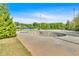 Outdoor skate park featuring a bowl-shaped skating area with surrounding park views and landscaping at 3321 Hampreston Nw Way, Kennesaw, GA 30144