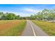 Scenic walking path through the park, complemented by lush greenery and convenient benches for a relaxing outdoor experience at 3321 Hampreston Nw Way, Kennesaw, GA 30144