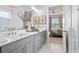 Elegant bathroom with double vanity, marble accents, and open access to bedroom, perfect for relaxation at 3543 Cedarvale Ct, Powder Springs, GA 30127